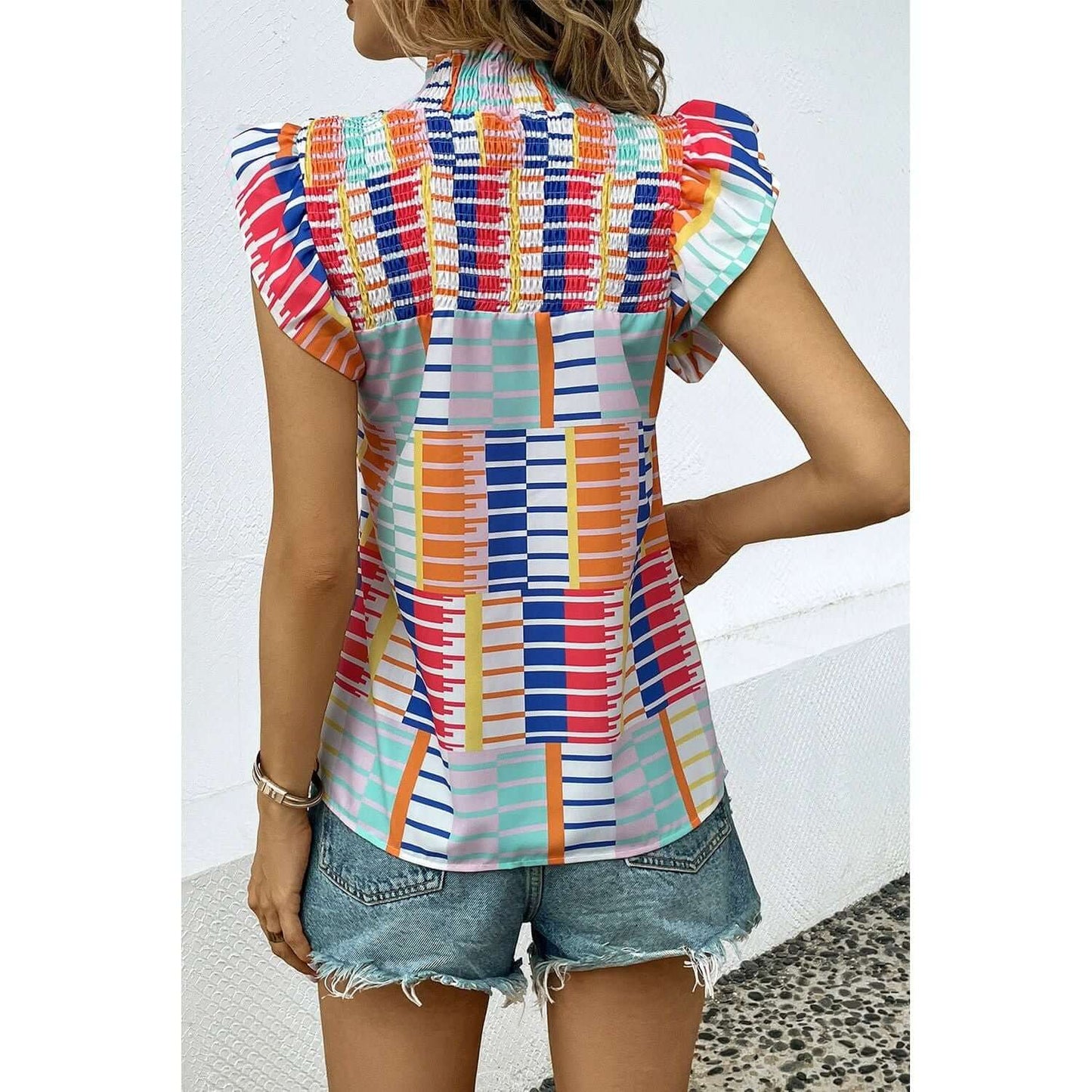 Blusa con mangas cortas y estampado de volantes